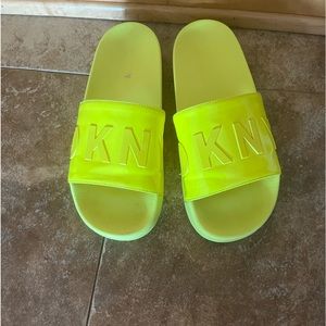 DKNY yellow flip flops